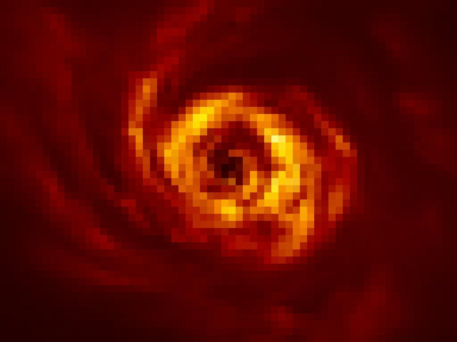 Die Materiescheibe um den Stern AB Aurigae ist in dieser Aufnahme mit dem VLT der ESO als rot-gelber Wirbel abgebildet.