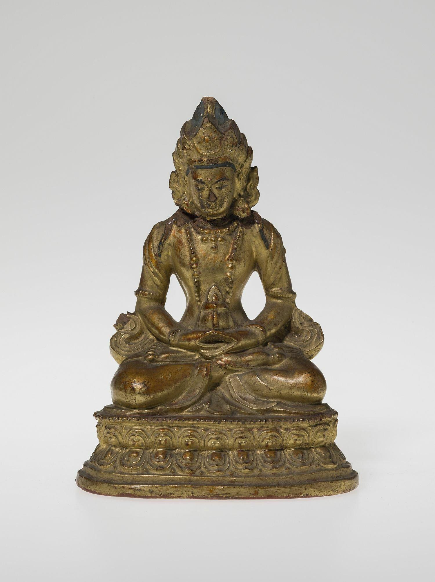 Vergoldete Figur eines sitzenden Buddha.