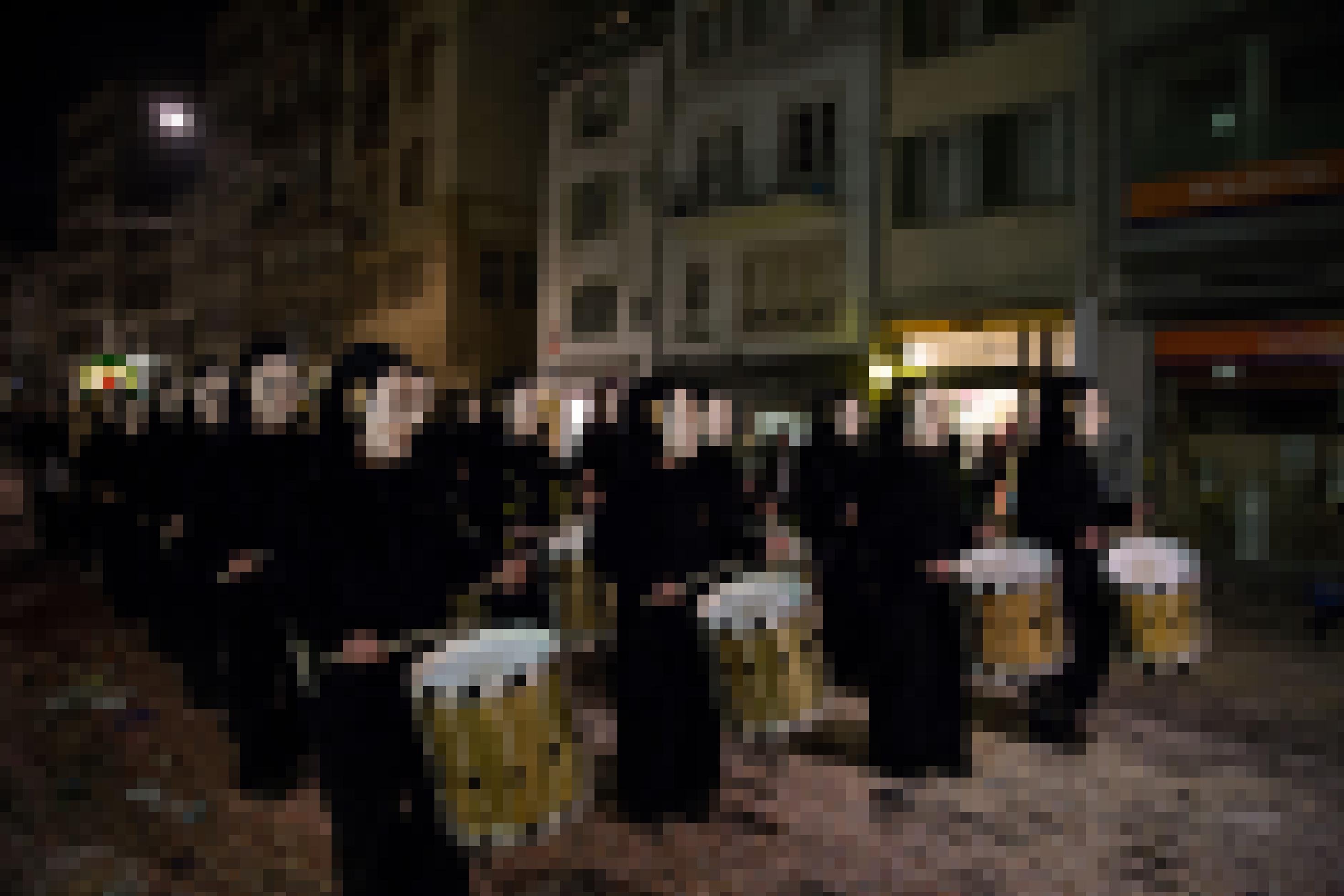 Basel, Switzerland – March 10, 2014: Group of so called Waggis with drums walking through the streets at the Basel carnival.