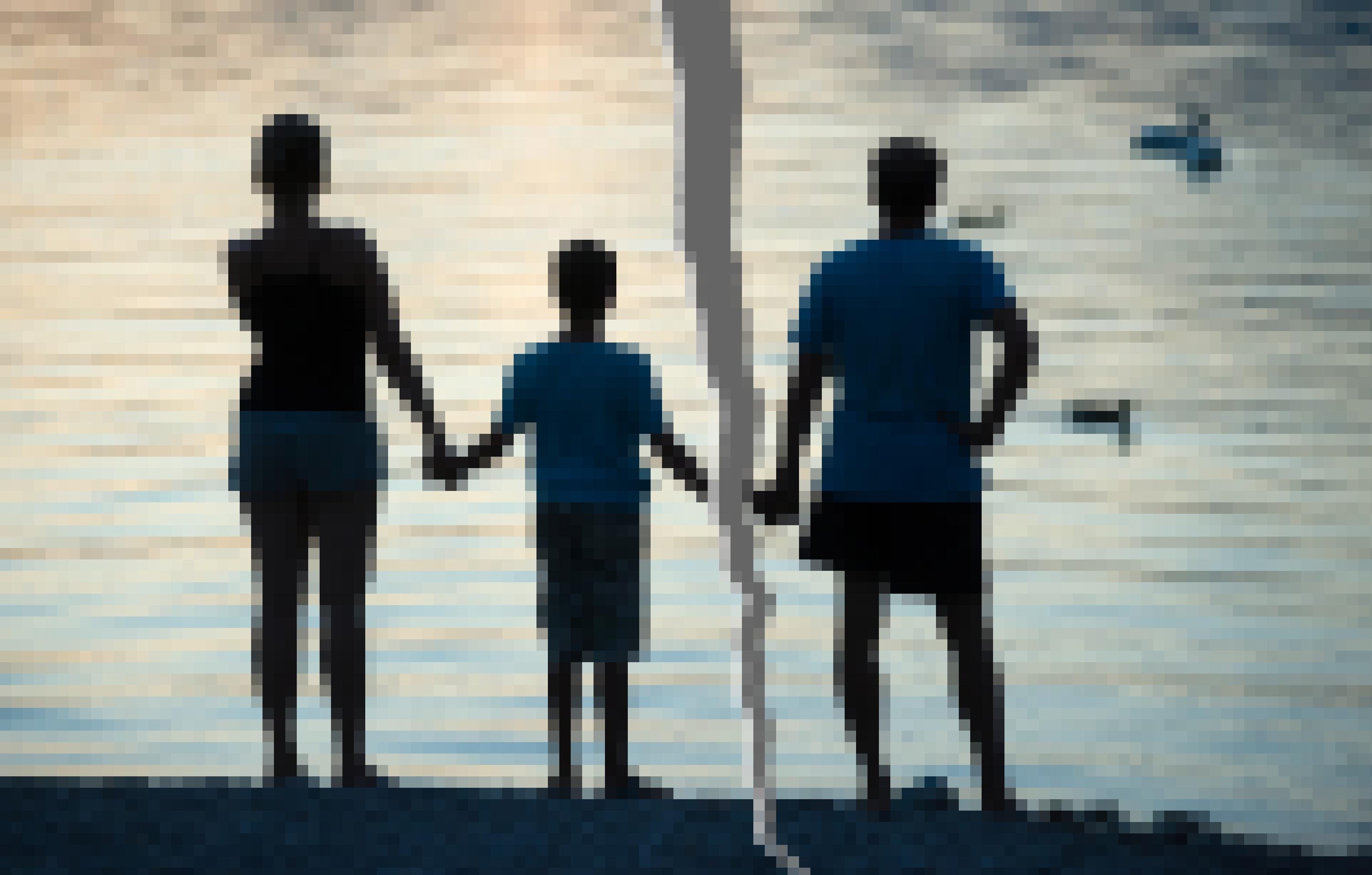 Familie in Trennung an einem See.