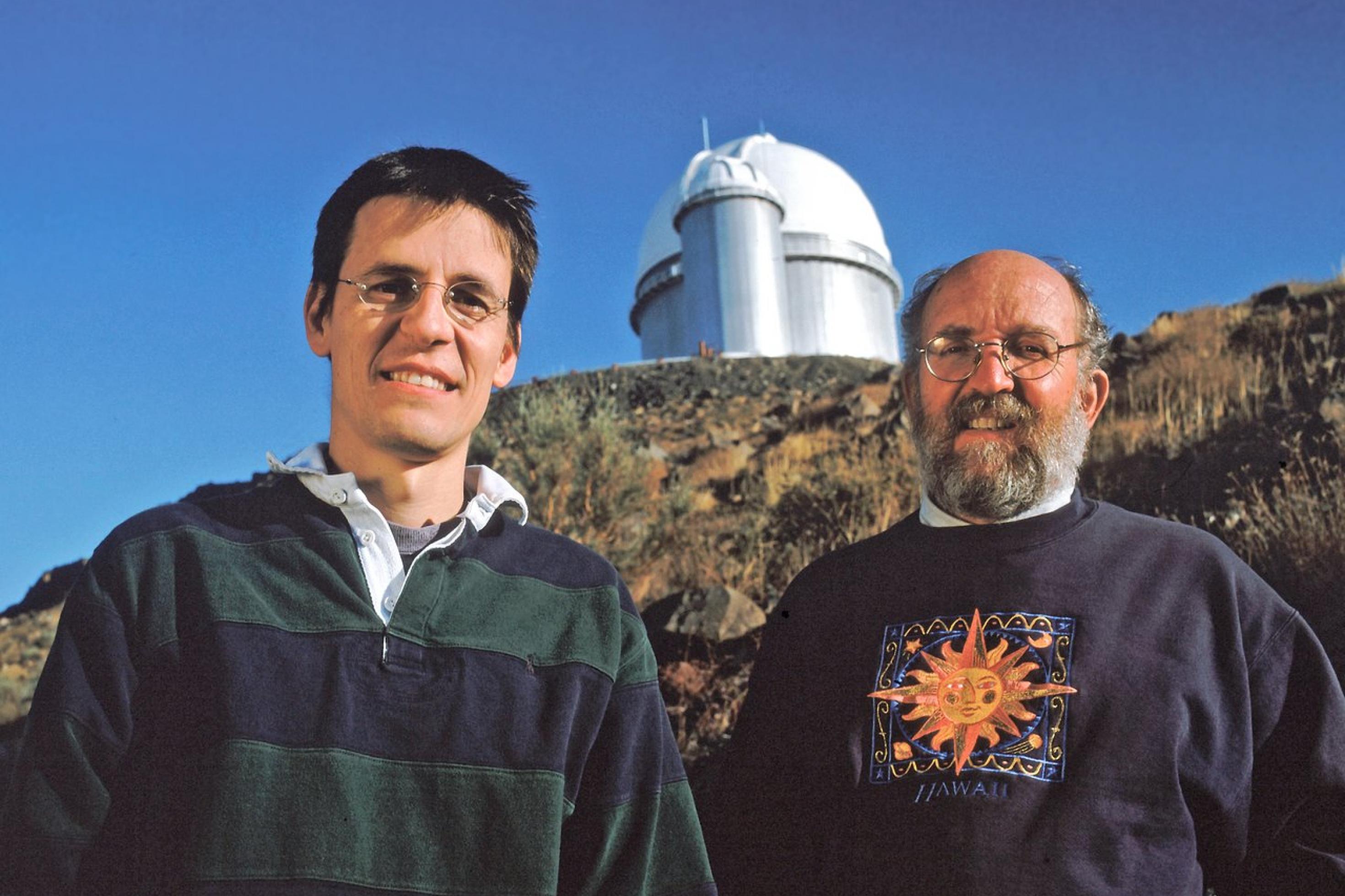 World-renowned Swiss astronomers Didier Queloz and Michel Mayor of the Geneva Observatory are seen here in front of ESO?s 3.6-metre telescope at La Silla Observatory in Chile. The telescope hosts HARPS, the world?s leading exoplanet hunter. They were awarded the 2011 BBVA Foundation Frontiers of Knowledge Award in Basic Sciences for their ground-breaking work on exoplanets.