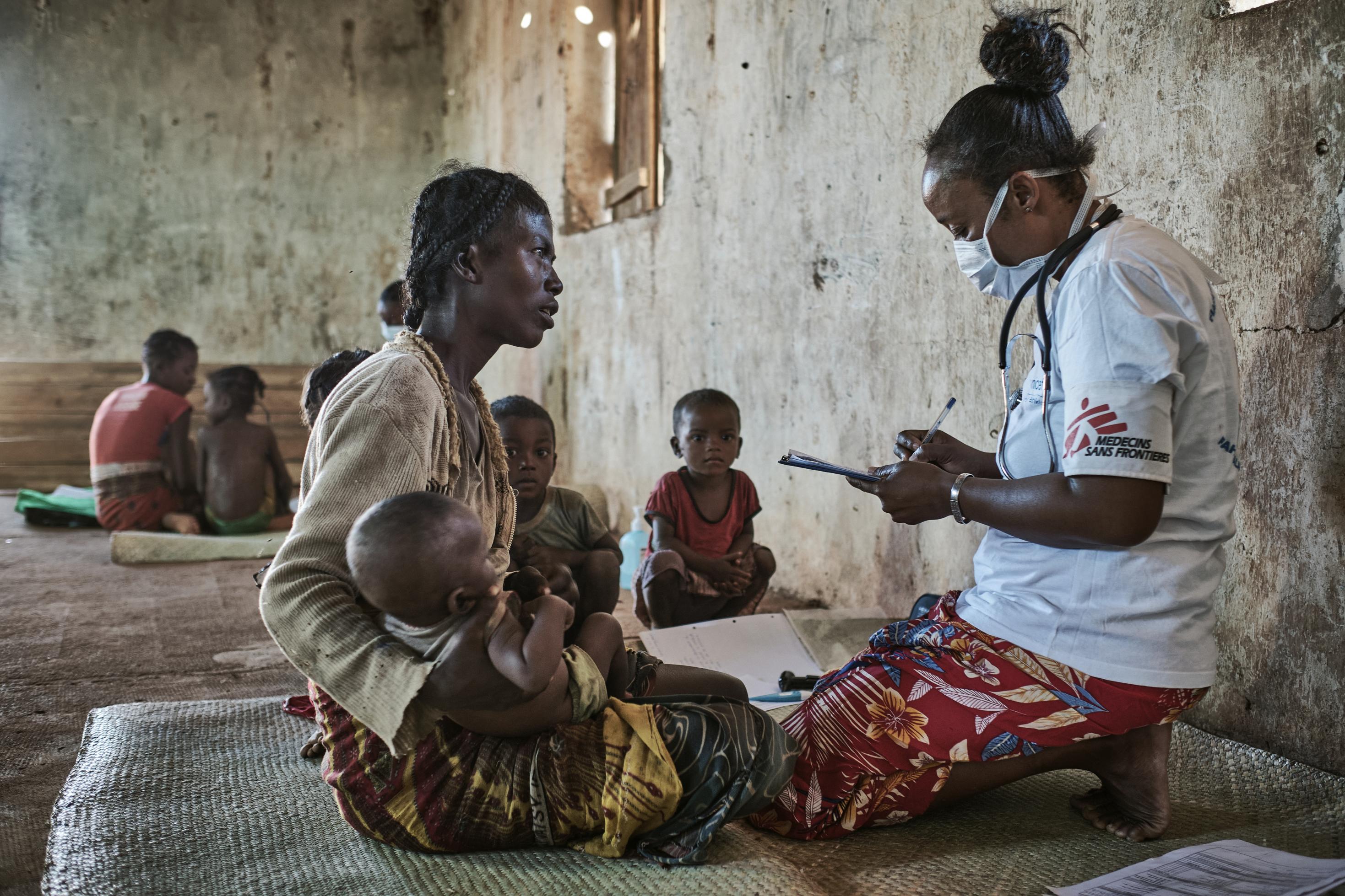 Commune of Ranobe, Amboasary District.

People in the south-east of Madagascar are facing the most acute nutritional and food crisis the region has seen in recent years. MSF began setting up mobile clinics in Amboasary district in late March to screen and treat acute malnutrition in remote villages like those of Ranobe commune, providing ready-to-use therapeutic food and medical care. 

42-year old Vitasoa has six children. She?s brought four of them to the Médecins Sans Frontières mobile clinic. All the children are included in the nutrition programme launched at the end of March to respond to the food and nutrition emergency in southern Madagascar. 
 
?We live in Fenoarivo, and it took us five hours to walk here from Ranobe. During the rainy season, we live off cassava, mangoes and edible leaves. But, nothing?s growing because there?s been no rain. We make do with manioc tubers we find in the forest, cactus fruit and edible leaves. We have to dig in the sand for water as there?s also less surface water. Every day we pray for rain. We?re staying positive, but we really hope it?ll come soon.?