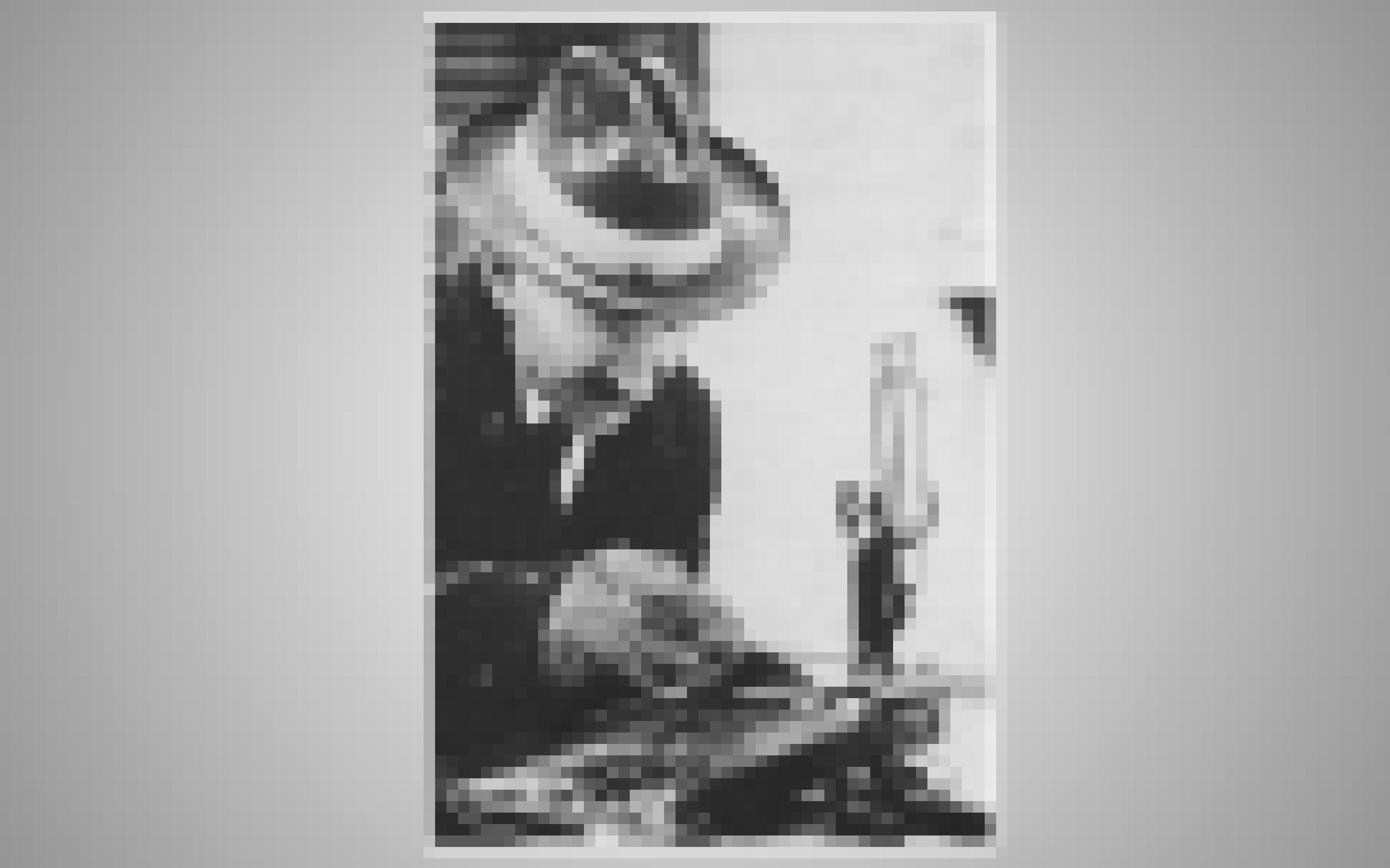 Wilson Bentley mit Handschuhen am Mikroskop.