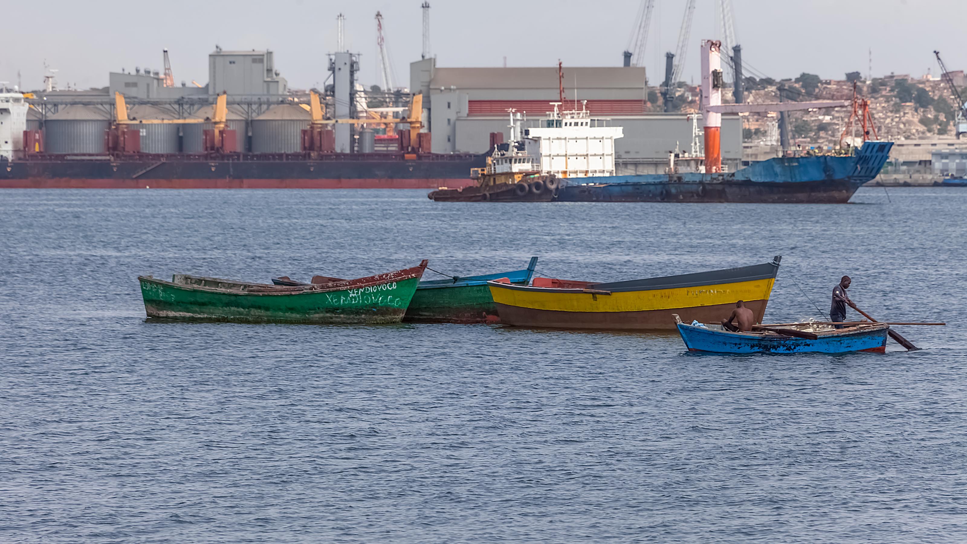 Luanda Angola – 10 13 2021: View of a fishing boats, oil tanker and Port of Luanda, port logistics center with containers as background, Luanda, Angola