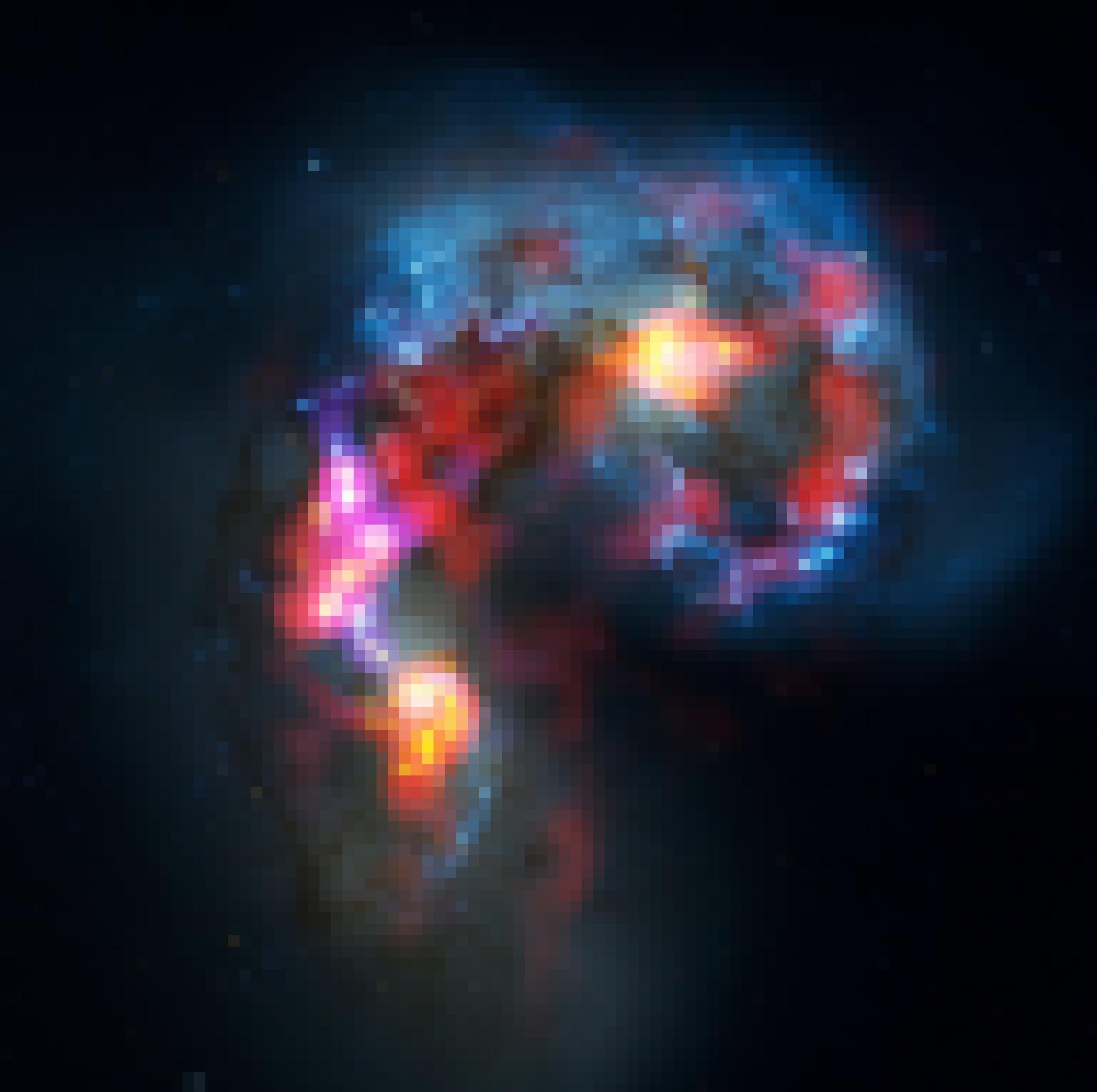 Die Antennengalaxien erzeugen beim Verschmelzen Sterne und Nebel. Die leuchten in gelb, rot und blau vor dem Schwarz des Alls und bilden eine Herzform.