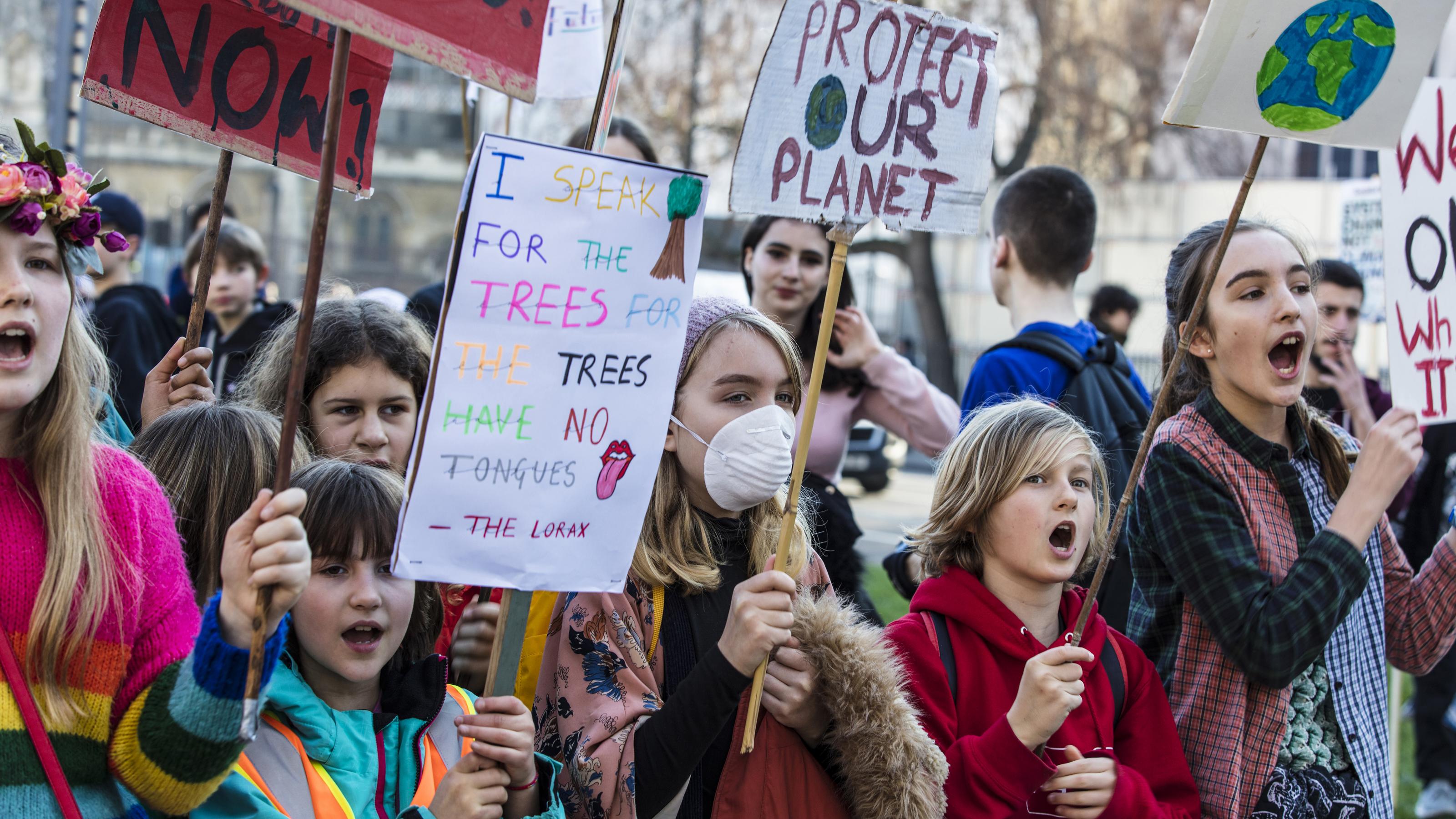 LONDON, UK – February 15, 2019: Protestors with banners at a Youth strike for climate march in central London