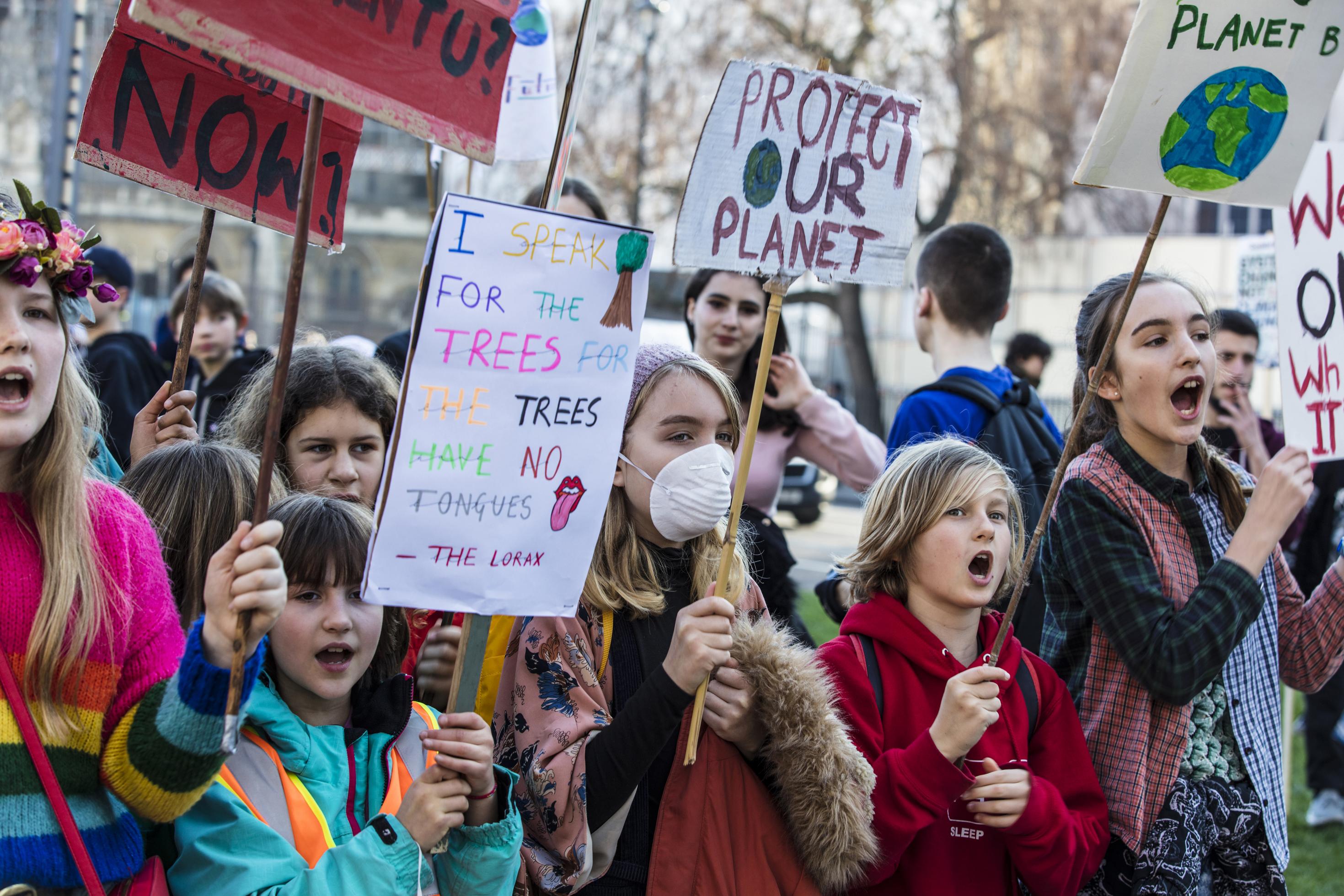 LONDON, UK – February 15, 2019: Protestors with banners at a Youth strike for climate march in central London