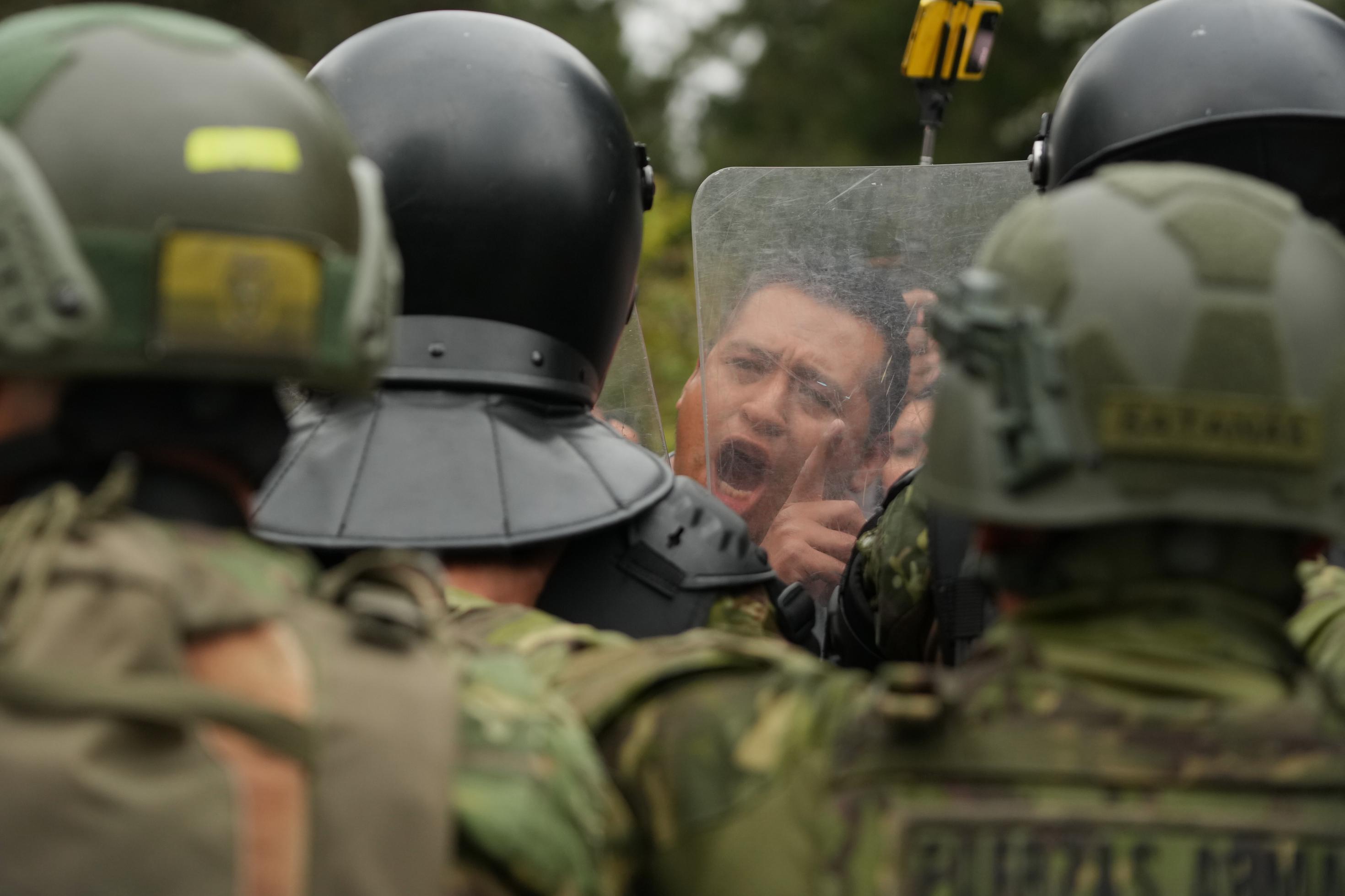 FILE - A man faces off with soldiers during an anti-government protest in Quito, Ecuador, Wednesday, Oct. 15,2025. (AP Photo/Dolores Ochoa, File)