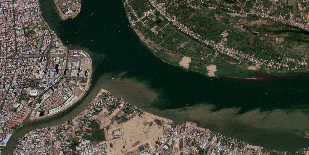 Luftaufnahme eines Flusses mit einer Stadt und Gebäuden [AI]