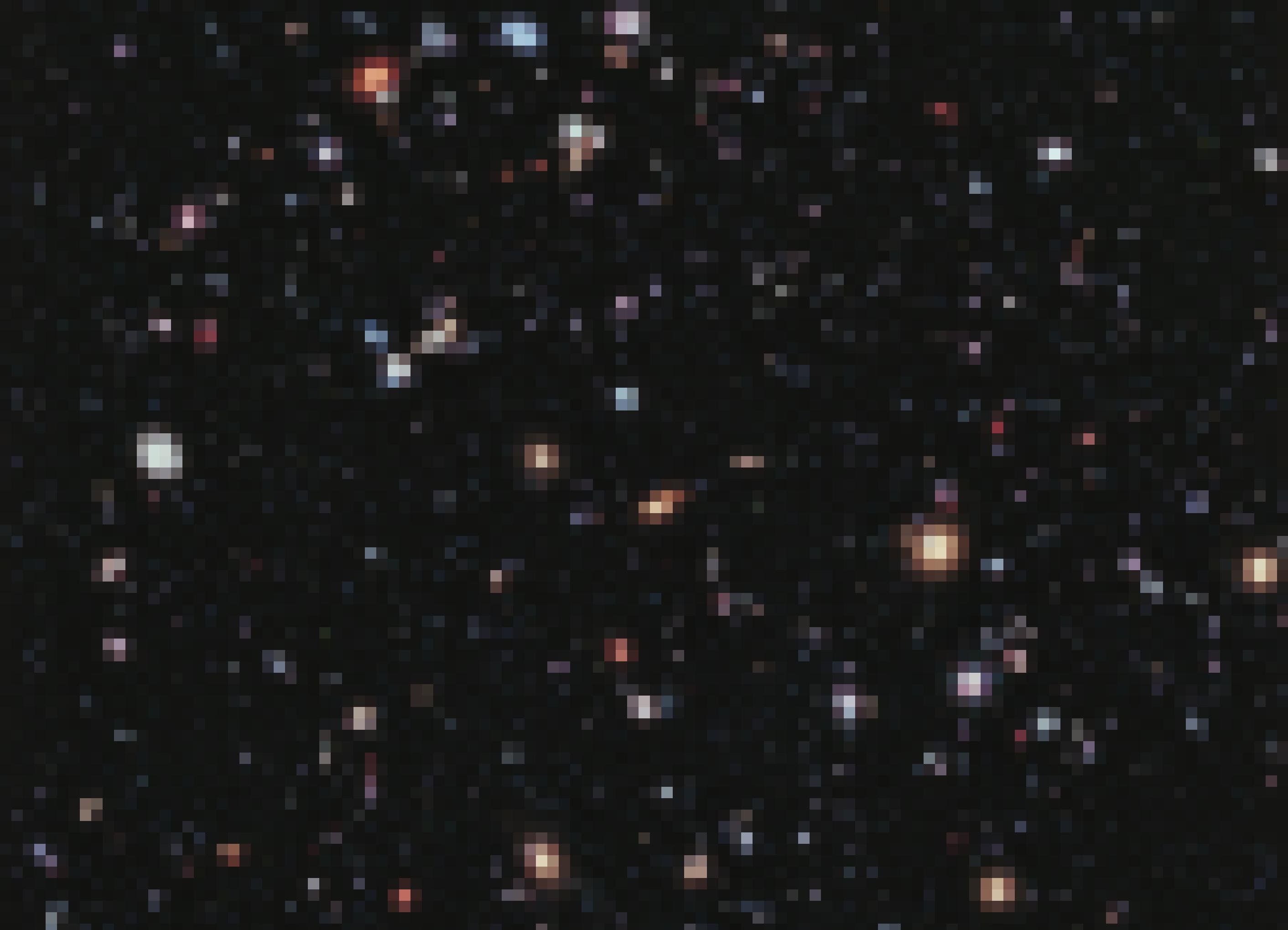 Vor dem schwarzen Hintergrund des Alls zu sehen sind zahllose, winzige Milchstraßensysteme. Sie sehen kreisförmig, elliptisch oder wie längliche Stäbchen aus, leuchten in rötlichen, weißen oder bläulichen Farbtönen und bei einigen sind Spiralstrukturen zu erkennen. Das Bild wurde aus 2000 vom Hubble-Weltraumteleskop aufgenommenen Einzelfotos zusammengesetzt und zeigt Objekte aus einer Zeit vor bis zu 13,2 Milliarden Jahren. Die ersten Galaxien müssen also bereits wenige hundert Jahrmillionen nach dem Urknall entstanden sein, der vor 13,8 Milliarden Jahren stattfand.