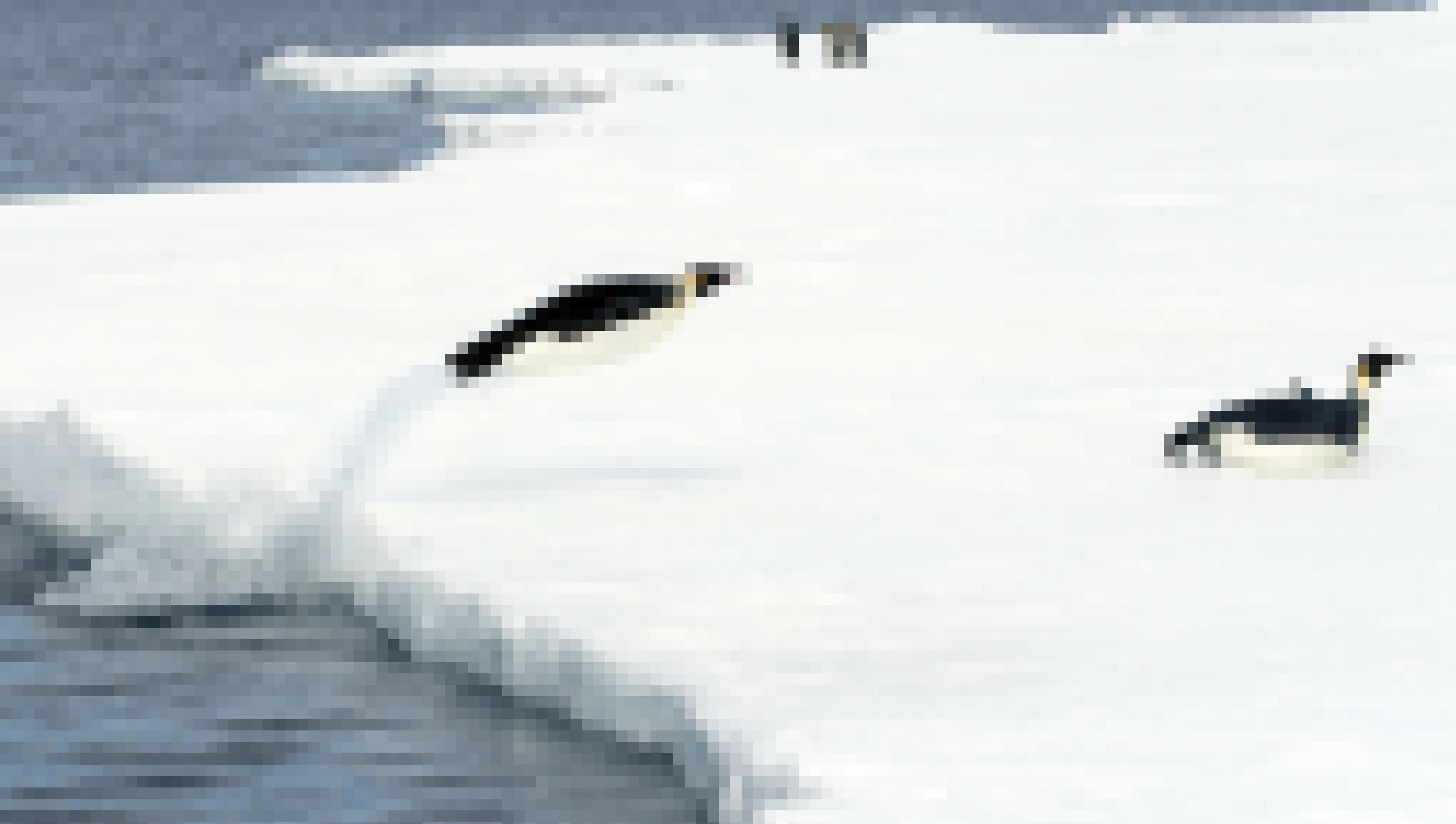 Emperor penguins (Aptenodytes forsteri) jumping out of the water onto the ice in the Weddell Sea, Antarctica