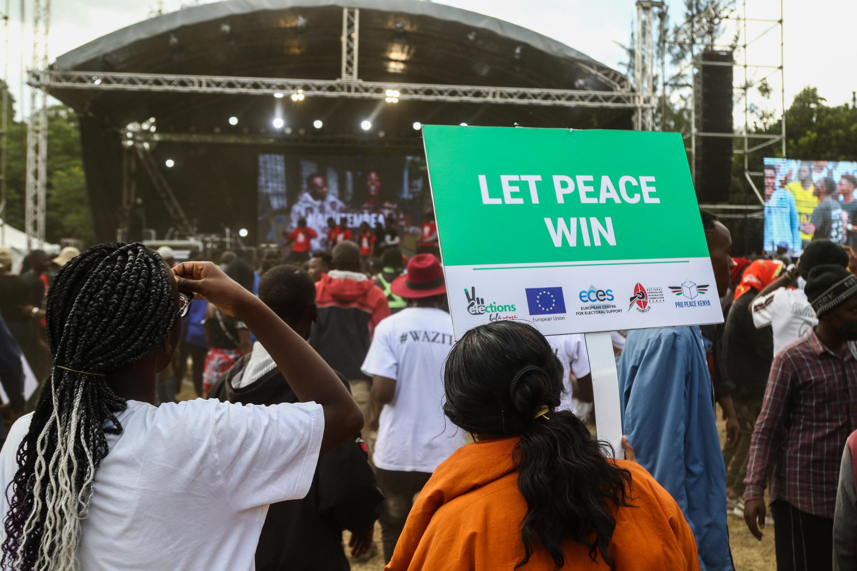 July 30, 2022, Nakuru, Rift Valley, Kenya: A participant holds a placard saying ''let peace win'' during a peace concert held to preach peace and harmony ahead of Kenya's August General Election. Kenyans will be going to the polls to choose their preferred president and members of both the national and county assemblies. (Credit Image: © James Wakibia/SOPA Images via ZUMA Press Wire