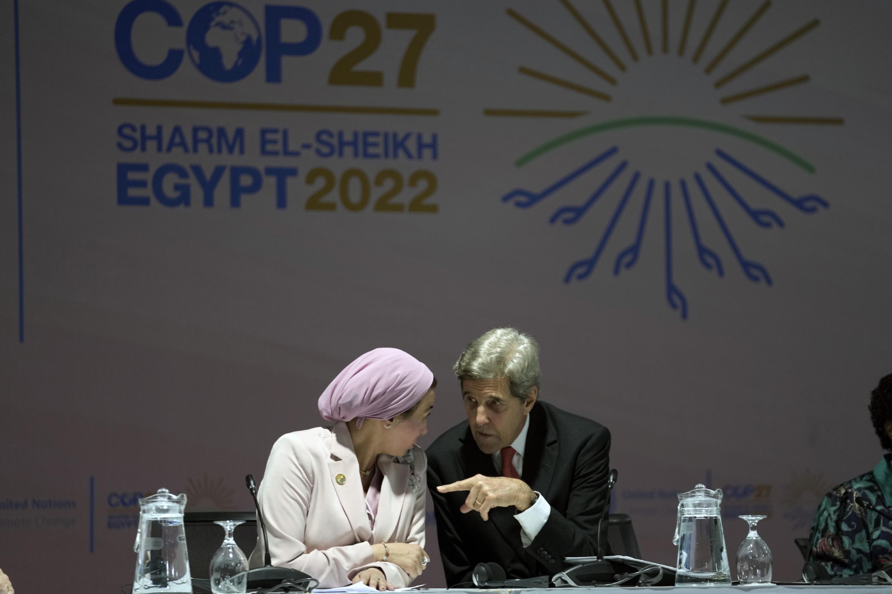 Egypt's Environment Minister Yasmine Fouad, left, and U.S. Special Presidential Envoy for Climate John Kerry talk before a panel on biodiversity at the COP27 U.N. Climate Summit, Wednesday, Nov. 16, 2022, in Sharm el-Sheikh, Egypt.