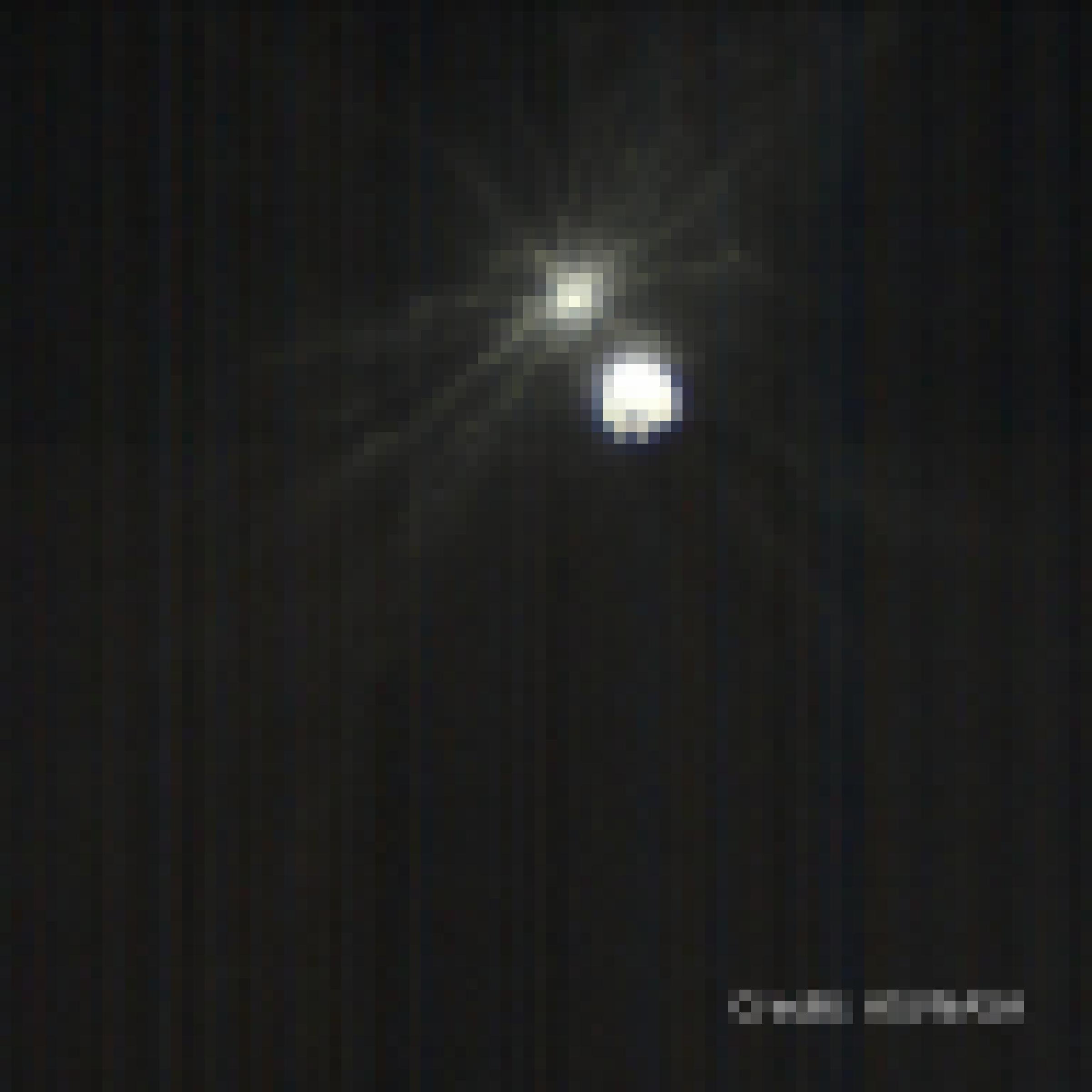 Aufnahme aus größerer Entfernung, die Auswurfstrahlen erstrecken sich über mehrere Durchmesser des großen Asteroiden Didymos.