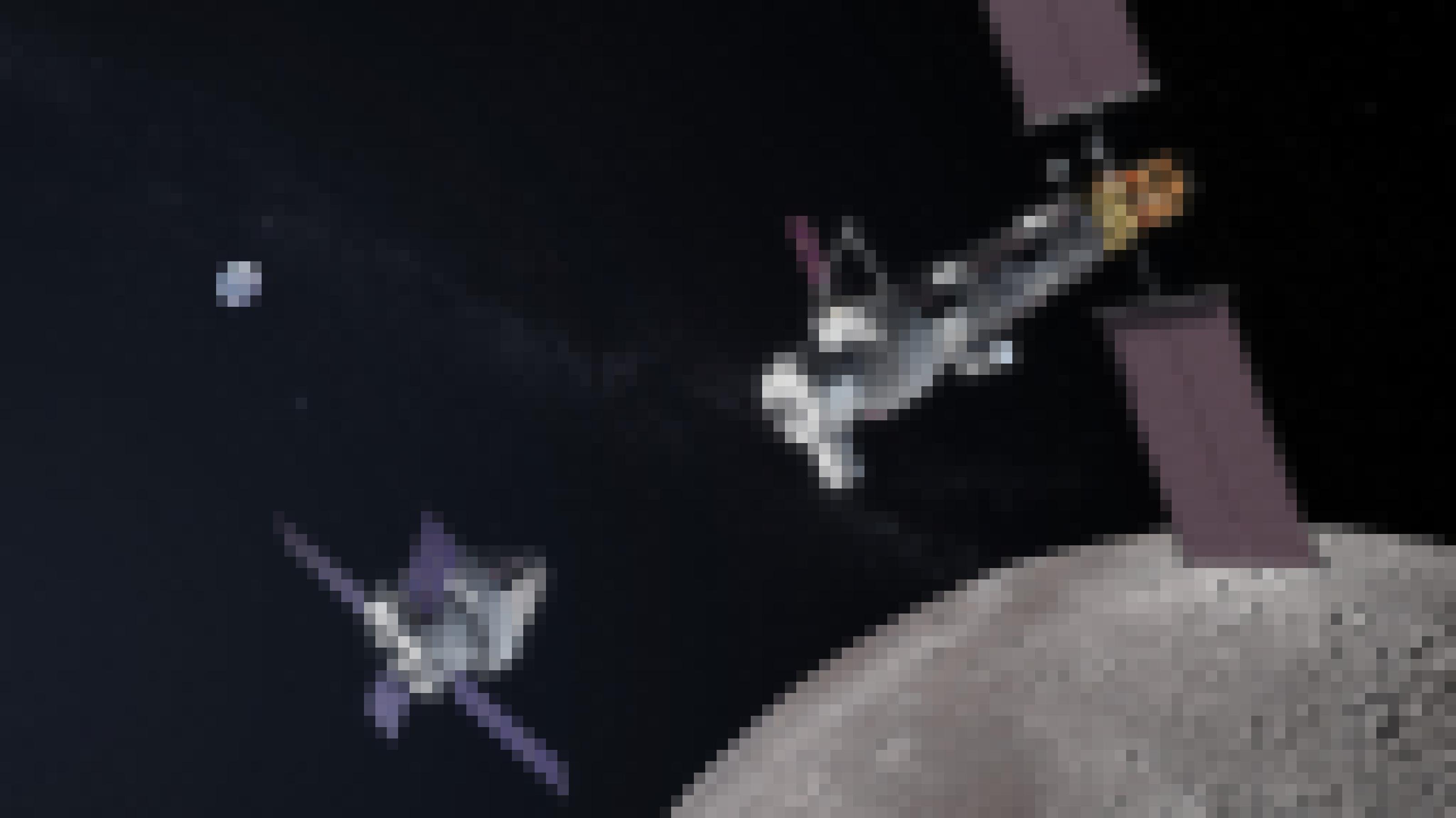Grafik: Lunar Gateway beim Rendezvous mit einem Orion-Raumschiff im Mondorbit, im Hintergrund die kleine Erde