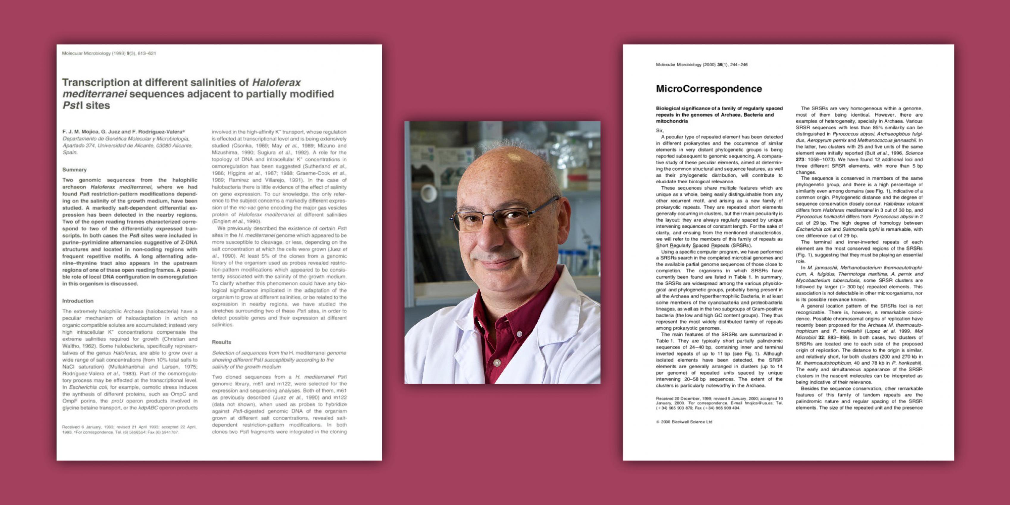 Portrait von Francisco Mojica zwischen zwei wichtigen Fachartikeln seiner CRISPR-Forschung vor himbeerrotem Hintergrund.