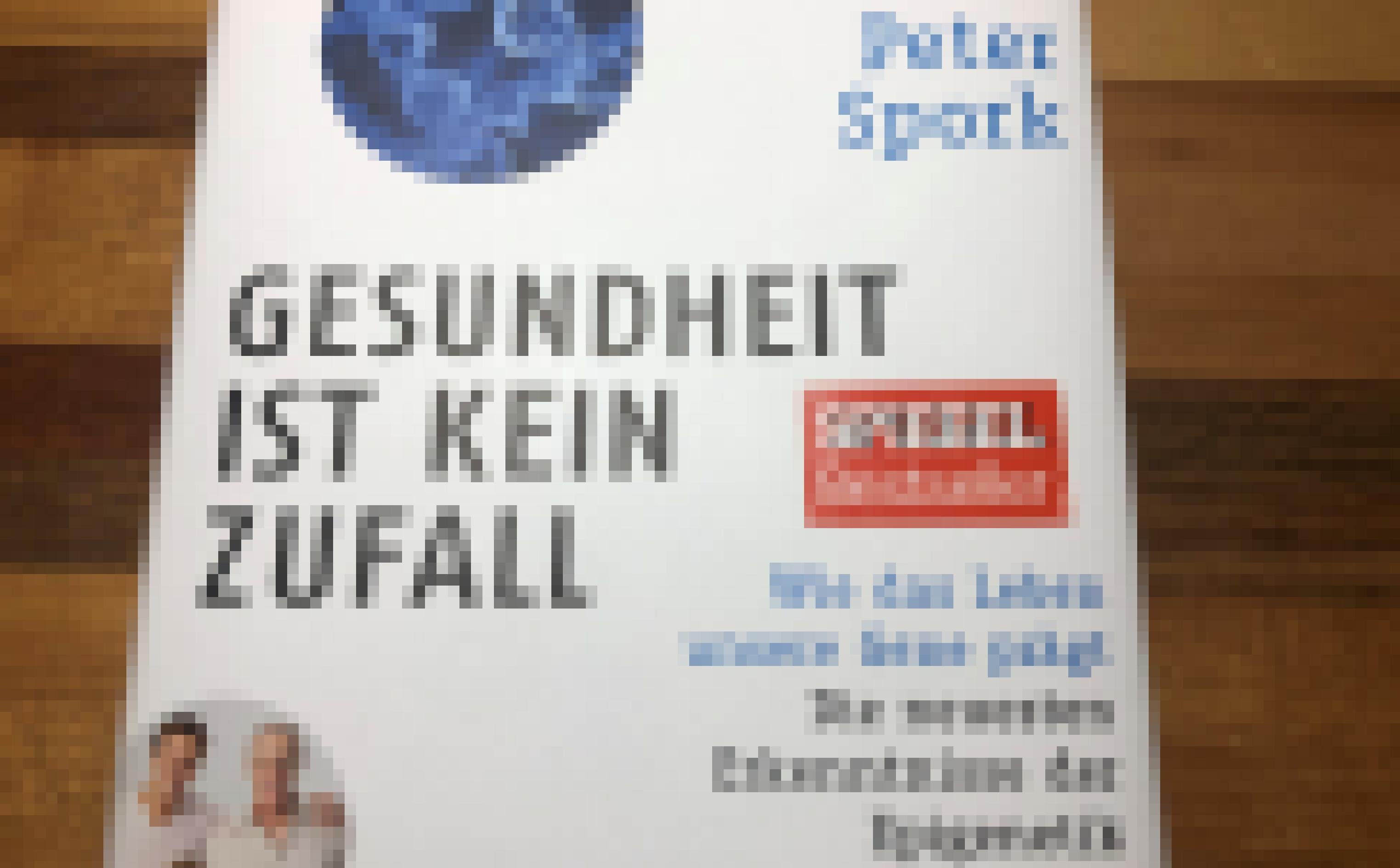 Ein Buch mit der Aufschrift "Gesundheit ist kein Zufall" von Peter Spork