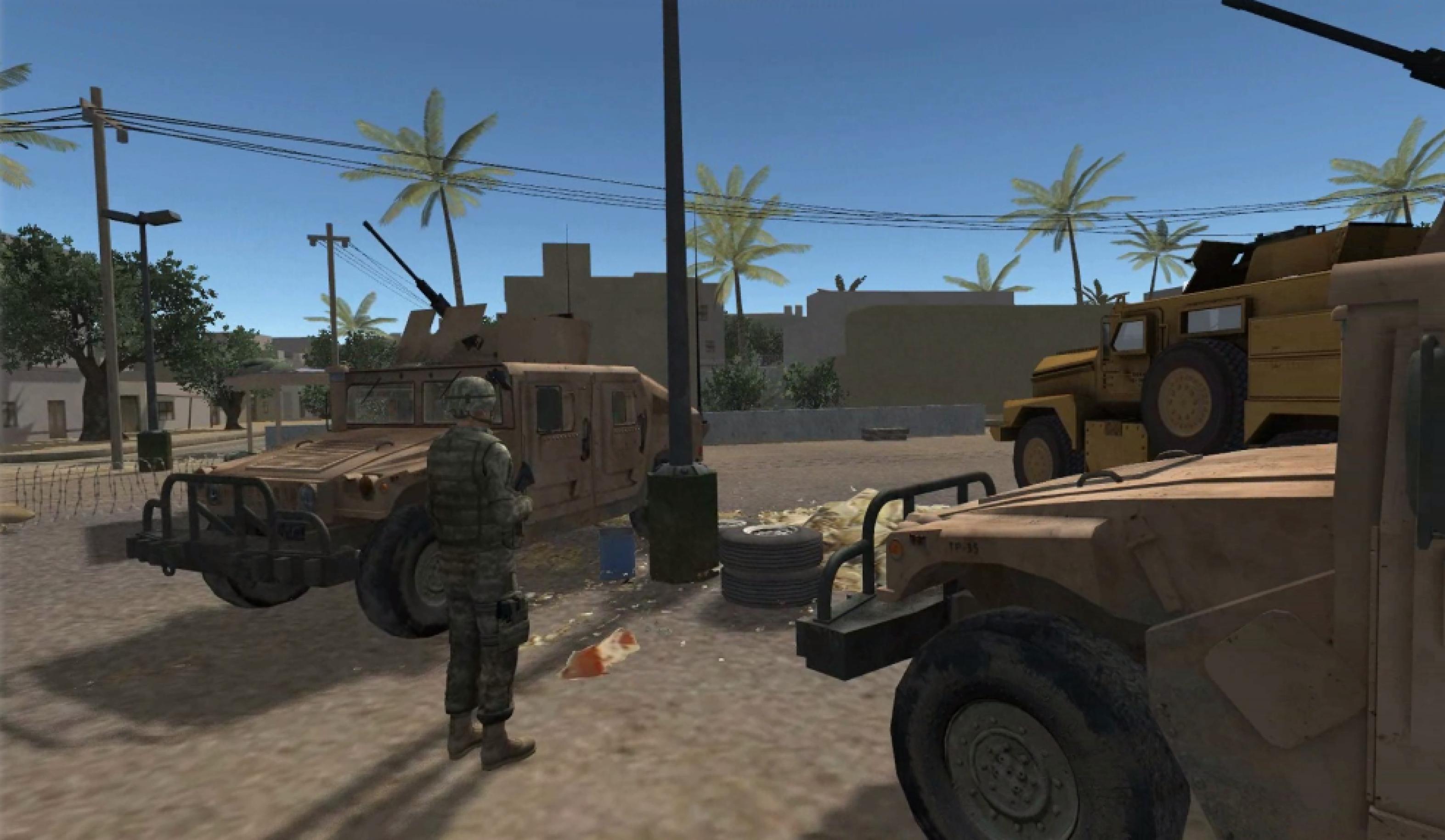 Eine Therapie-Szene in der virtuellen Realität: Ein Soldat steht auf einem sandigen Platz in einem kleinen afghanischen Dorf. Um ihn herumparken drei gepanzerte Militärfahrzeuge.