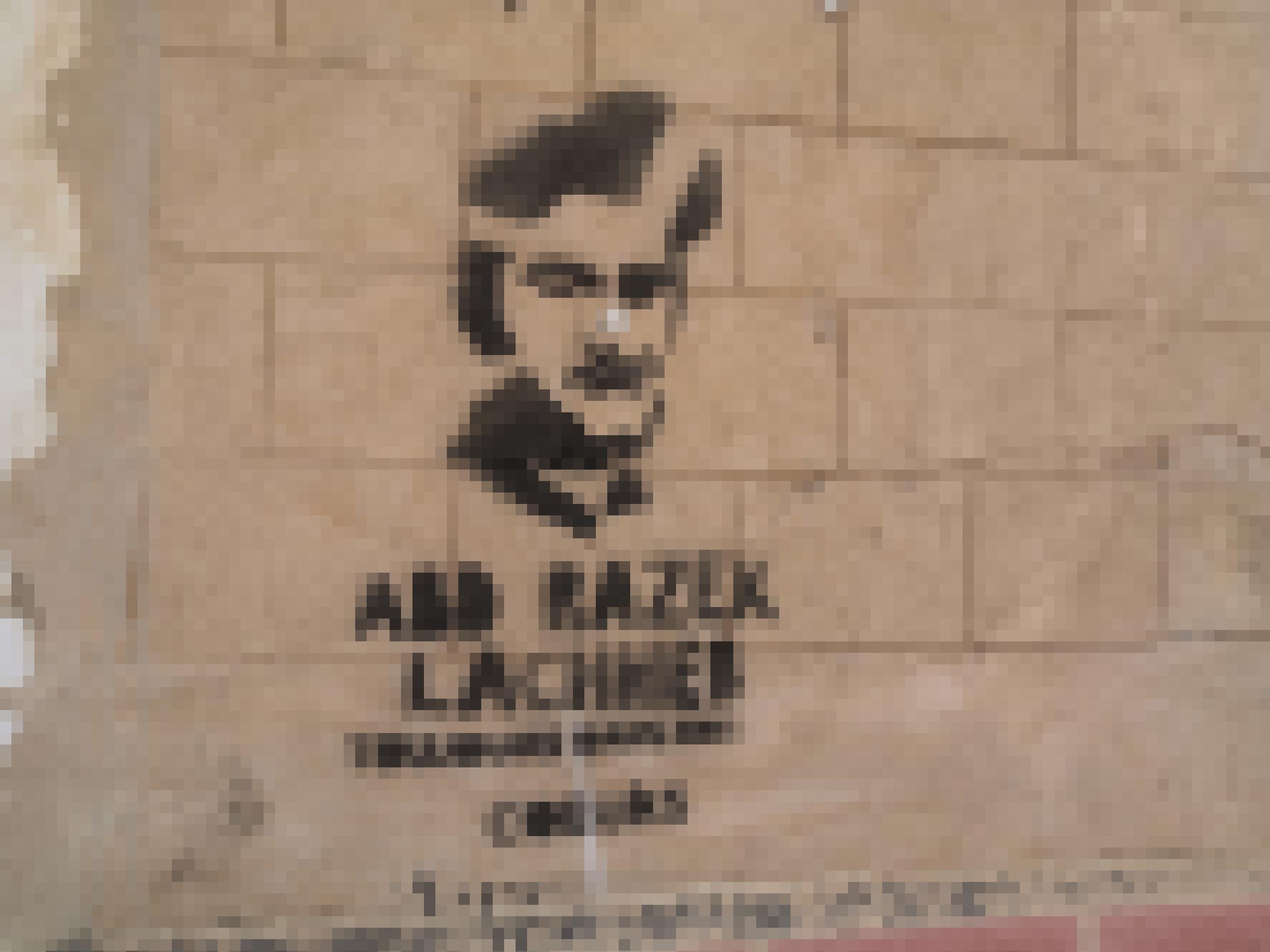 Grafitti zeigt das Porträt eines jungen Mannes