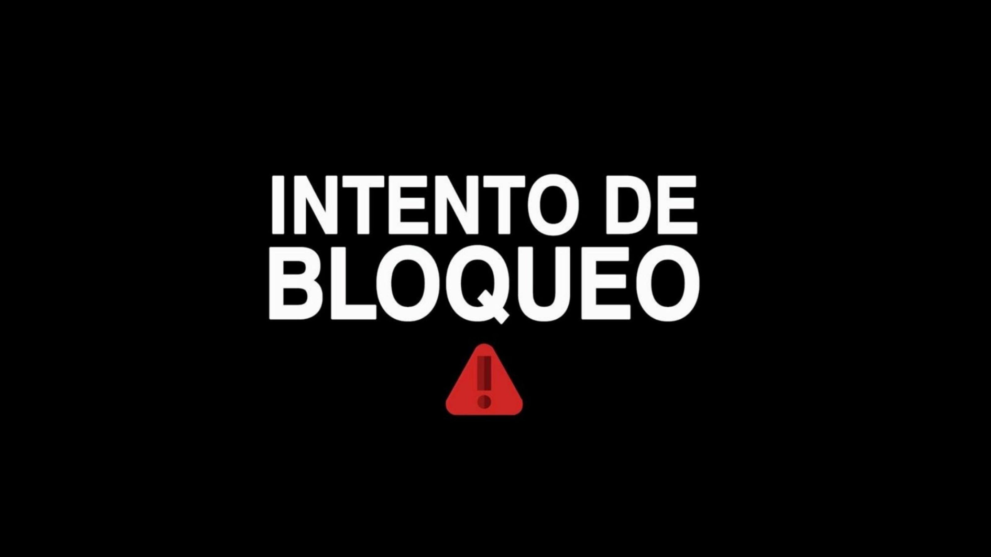 Auf einer sonst schwarzen Seite steht in Weiß „Intento de bloqueo“, darunter ein rotes Warn-Dreieck.